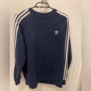 Blue Adidas Crewneck with white stripes down the arms of sweater